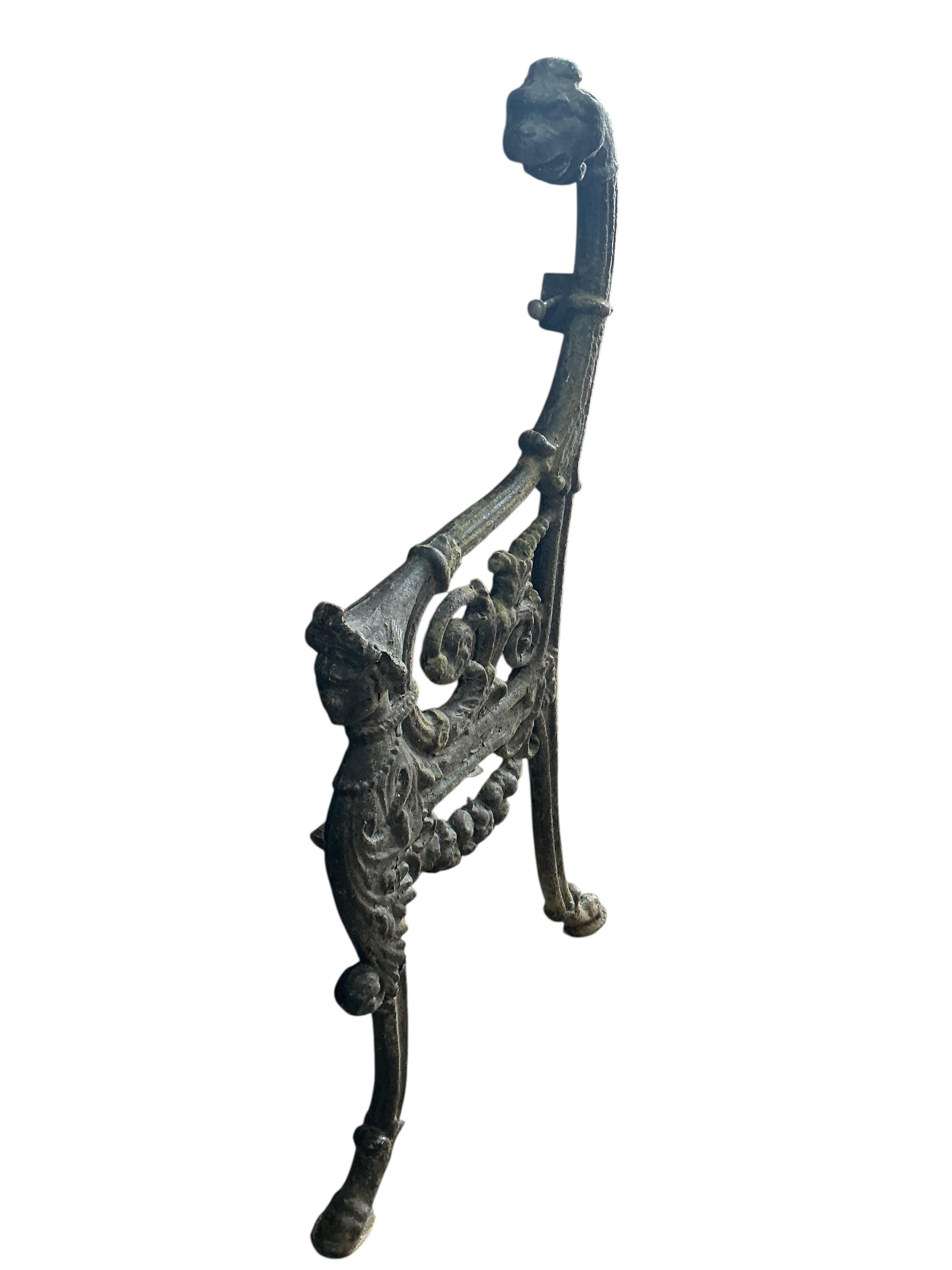 A pair of Victorian cast iron leopard's head bench ends, height 94cm